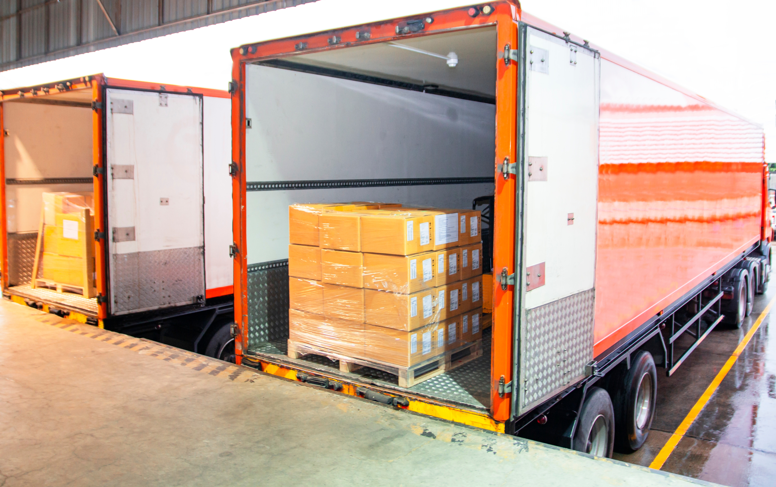 Cargo being loaded into a trailer at a loading dock.