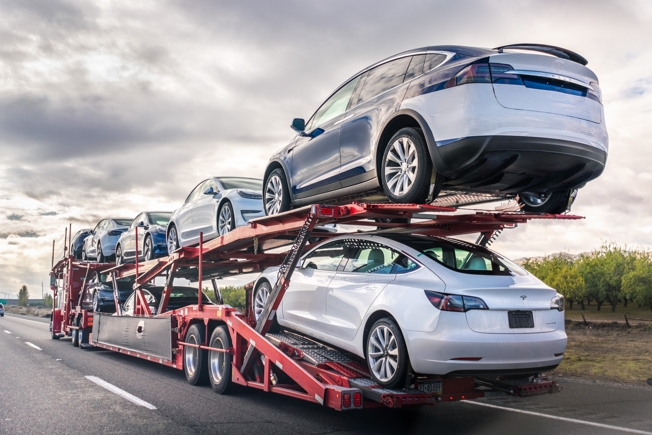 Side view of a car hauler full of inventory.